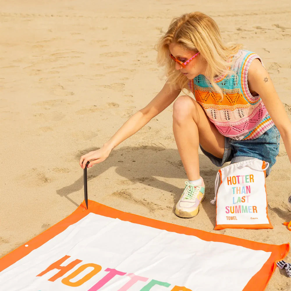 Beach towel "hotter than last summer"